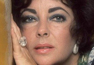Elizabeth Taylor Retrospective...Manadatory Credit: Photo by Reginald Davis / Rex Features (918434AT) Elizabeth Taylor in New York. Showing her wearing the Richard Burton 38K diamond ring Elizabeth Taylor Retrospective